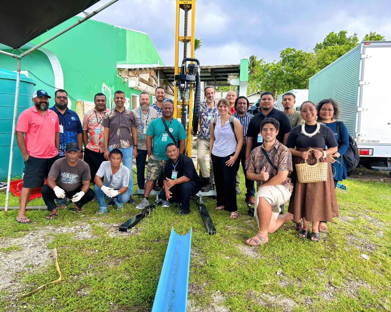 Participants seeing the set-up of the drill used to tap into ground water sources in the atolls